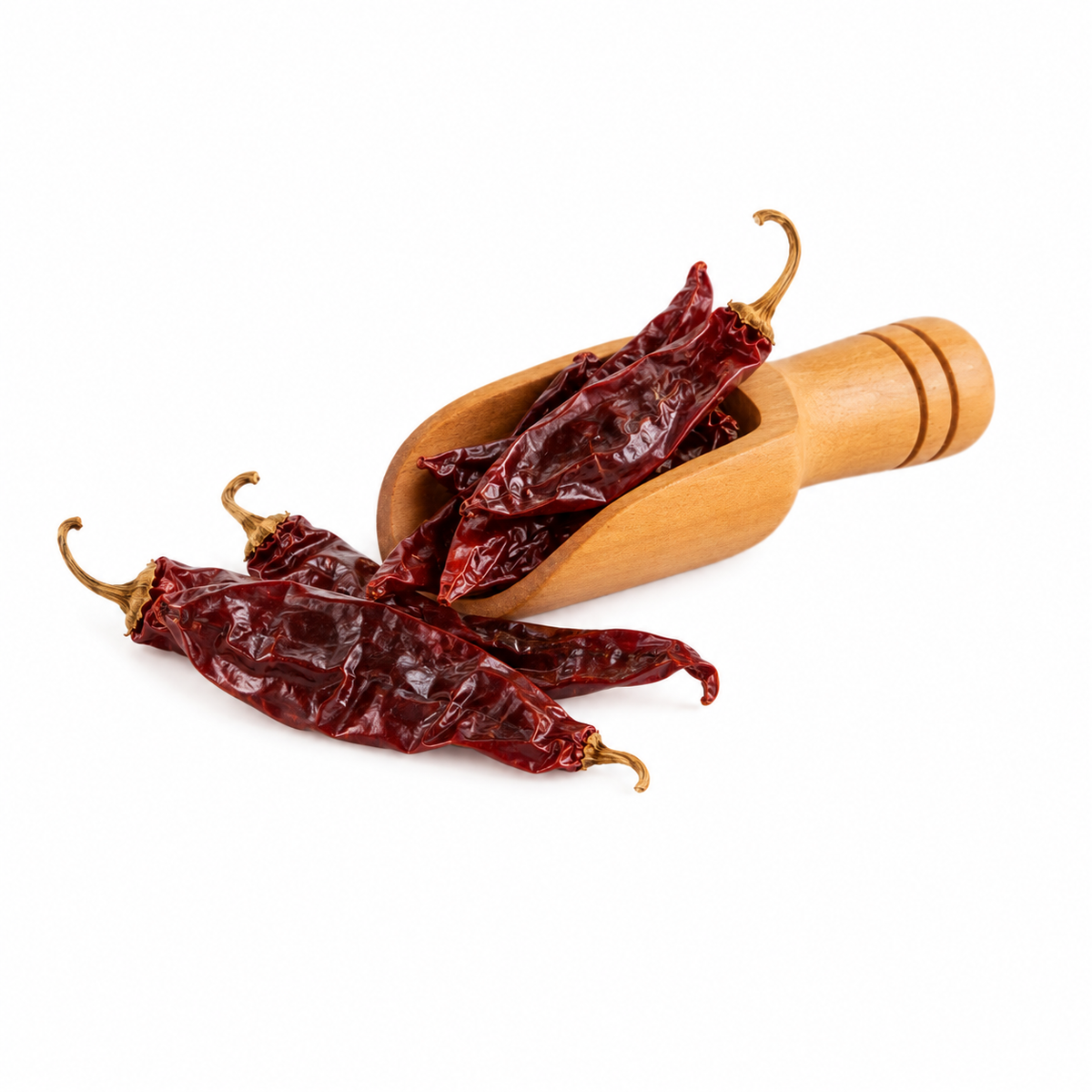 Chile guajillo entero en cucharita de madera – presentación de 50 g