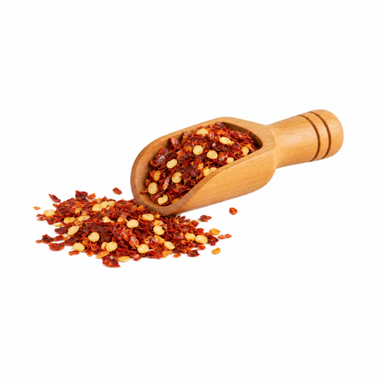 Chile picante en escamas en cucharita de madera
