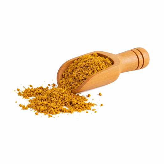 Mezcla de curry en cucharita de madera