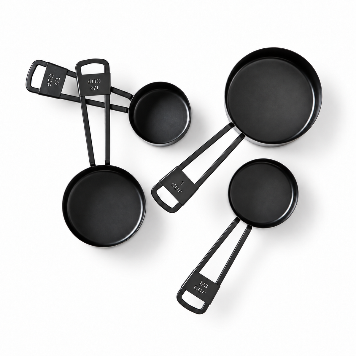 Set de Tazas Medidoras Negras sobre fondo blanco